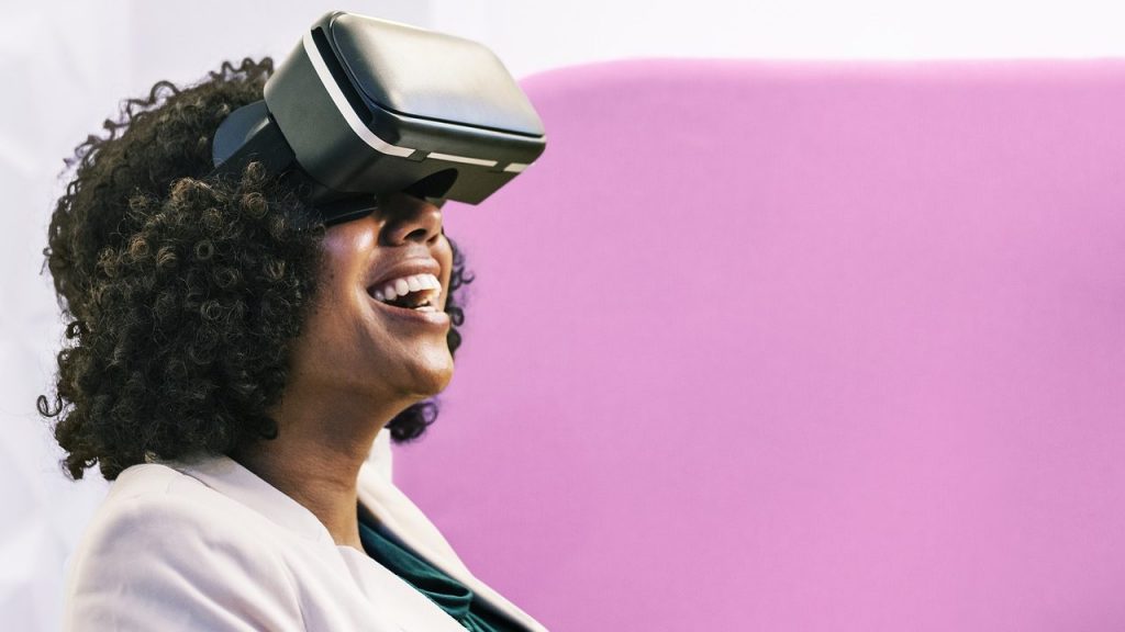 A female employee using virtual reality goggles for corporate training