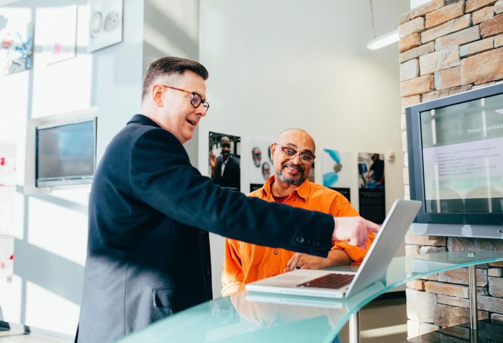 Two people going through a sales training scenario