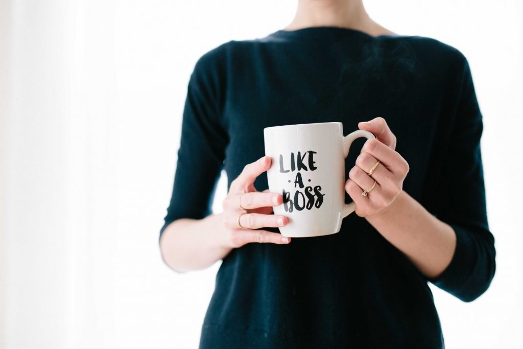 woman holding a mug implying leadership development