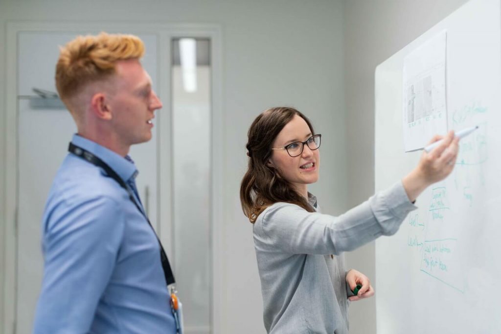 Two people planning goals for VR training scenarios